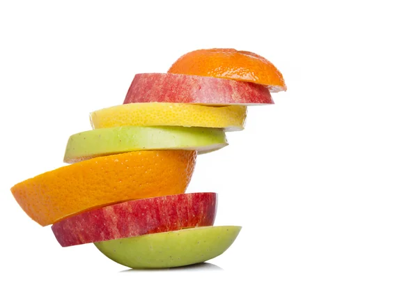 Stack of sliced fresh fruit, isolated on white background — Stock Photo, Image