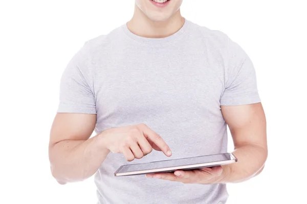Przystojny mężczyzna przy użyciu komputera typu tablet, na białym tle nad powrotem biały — Zdjęcie stockowe