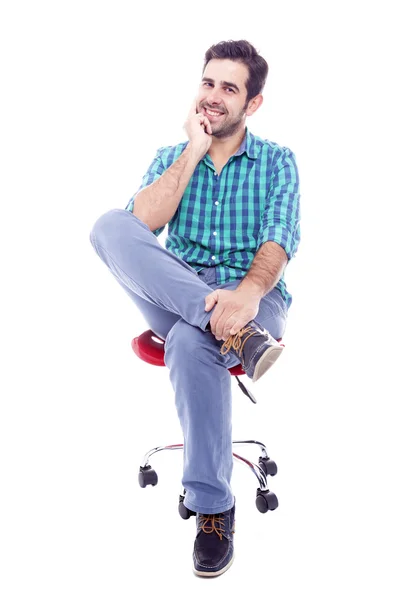 Portrait of a thoughtful man sitting on the chair — Stockfoto
