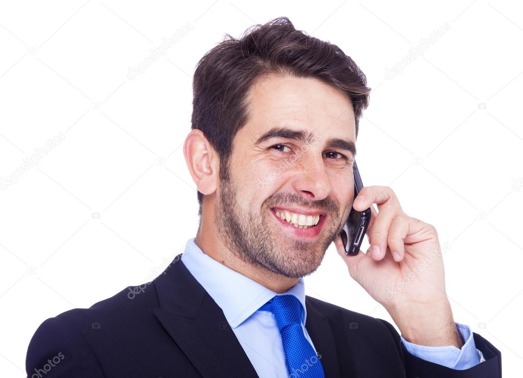 Handsome business man talking on the phone