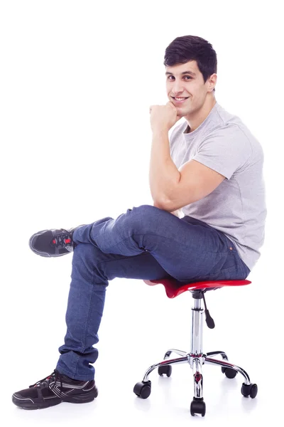 Latin man sitting on a chair — Stock Photo, Image