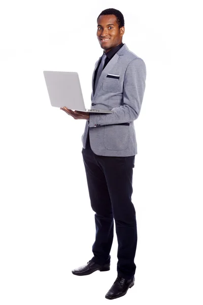 Homem de negócios com um laptop — Fotografia de Stock