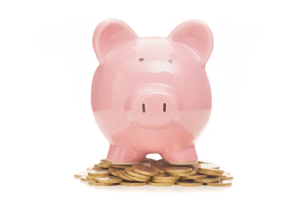 Piggy bank and coins on white background — Stock Photo, Image