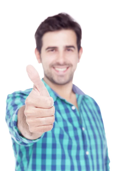 Handsome latin man thumbs up over a white background Royalty Free Stock Images