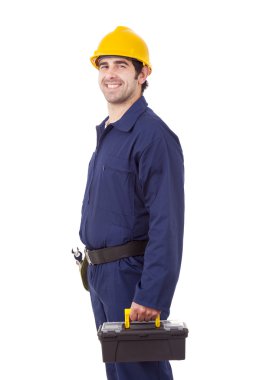 gülümseyen bir araç tutan genç bir işçi, üzerinde beyaz izole