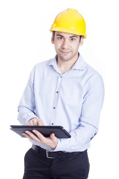 Beau ingénieur travaillant avec une tablette pc, isolé sur blanc — Photo