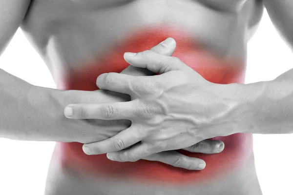 胃の痛みを白で隔離される腹部に触れるを持つ男 — ストック写真