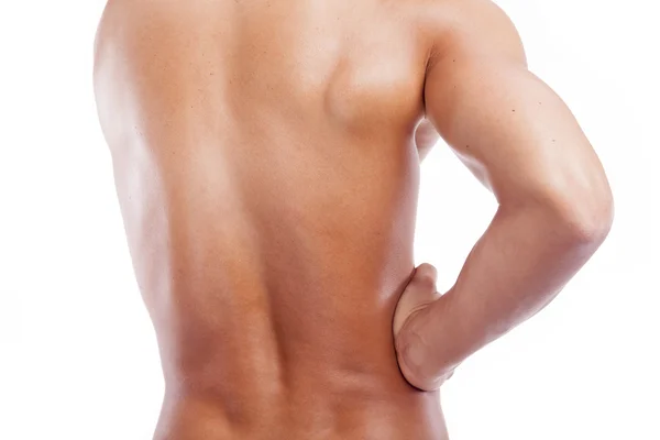 Homem musculoso segurando as costas com dor, isolado no backgro branco — Fotografia de Stock