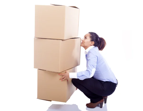 Business woman lifting card boxes — Stock Photo, Image