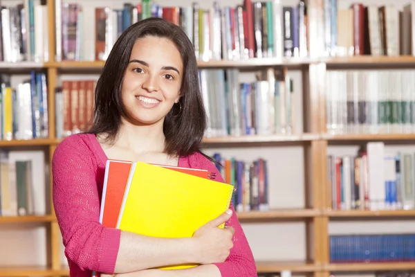 Student holding books — Stock Photo, Image