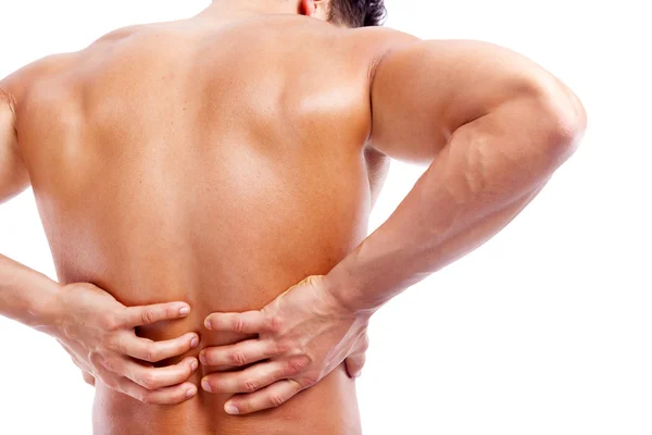 Man holding his back in pain — Stock Photo, Image