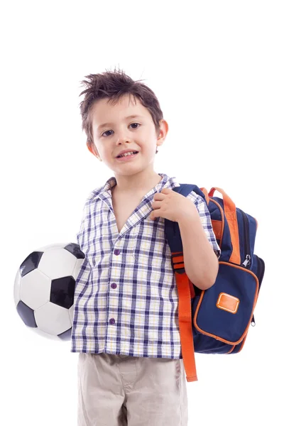 Menino da escola feliz segurando uma bola de futebol — Fotografia de Stock