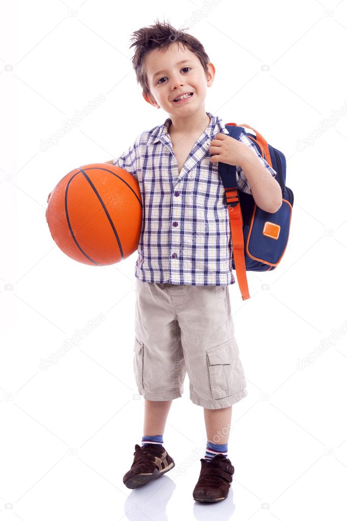 Happy school kid holding a basket ball