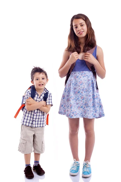 School kids standing against white background — Stock Photo, Image