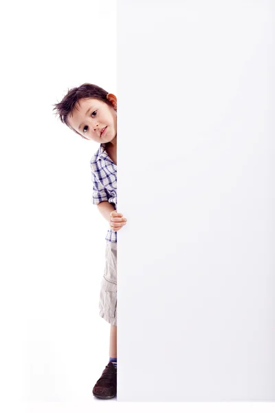 Little boy holding a white banner, isolated on white background — Stock Photo, Image