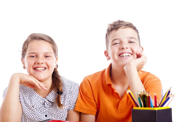 Two school kids at desk — Stock Photo, Image