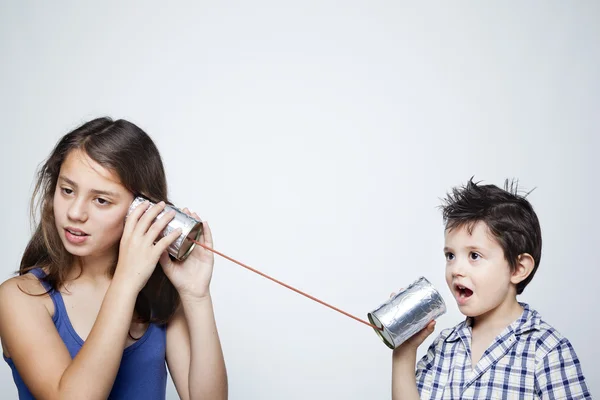 Kids using can as telephone — Stock Photo, Image