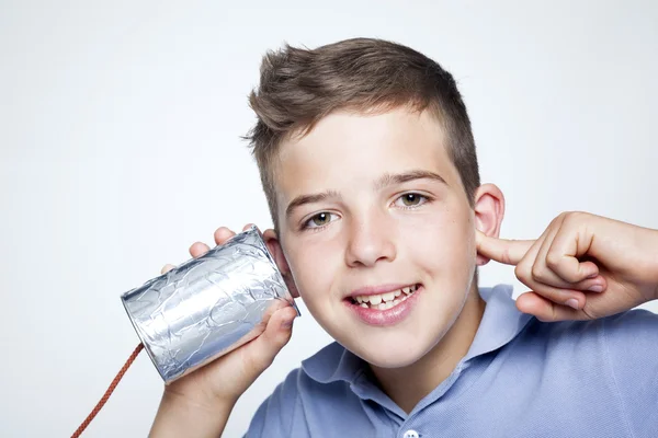 Boy using can as telephone — Stock Photo, Image