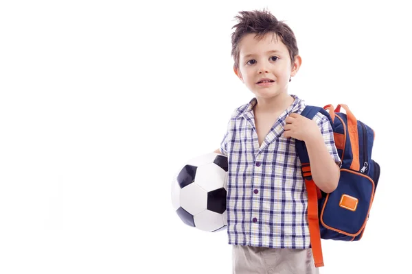 Escola garoto segurando uma bola de futebol — Fotografia de Stock