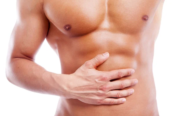 Muscular man having stomach pain — Stock Photo, Image