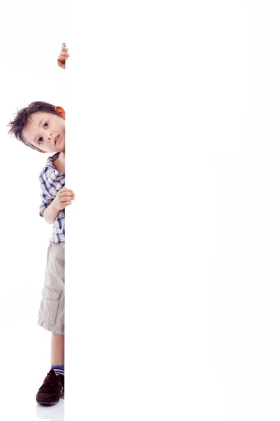 Niño sosteniendo tablero blanco — Foto de Stock