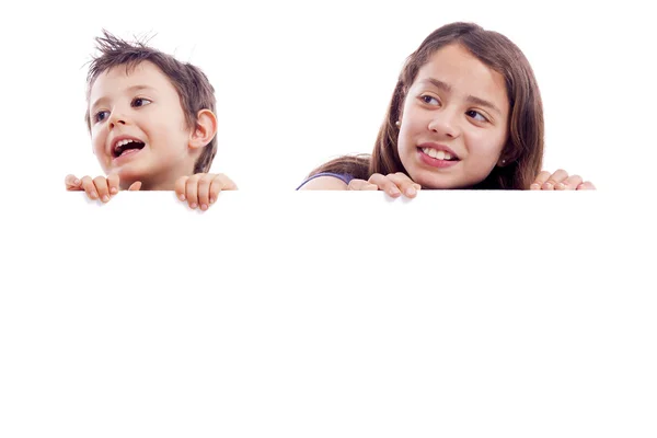 Kids holding white board — Stock Photo, Image