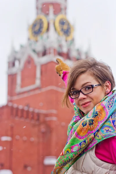 Young woman pointing at clock tower. — Stock Photo, Image