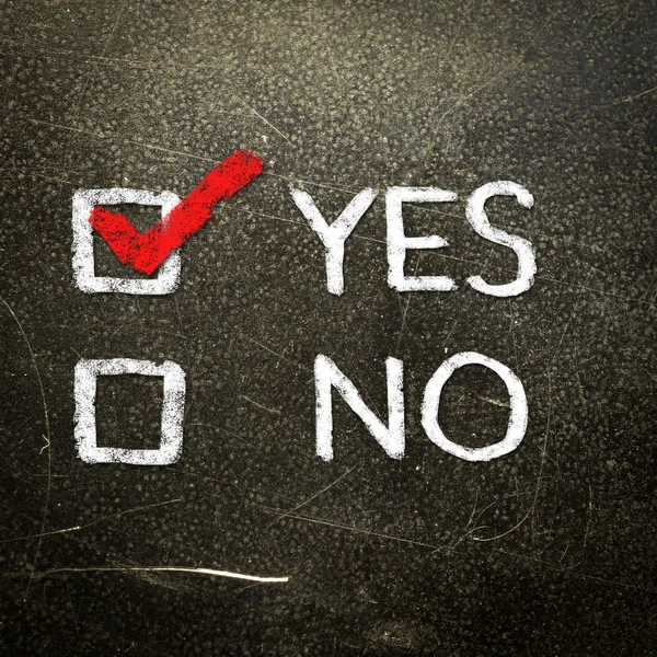 Yes or no written on the blackboard with white chalk. Your choice as a concept. — Stock Photo, Image