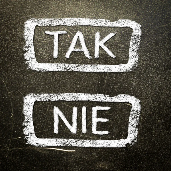 Tak or nie written on the blackboard with white chalk. Your choice as a concept. — Stock Photo, Image