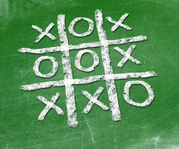 Noughts and crosses drawn on a chalkboard — Stock Photo, Image