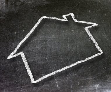 House drawn on a chalkboard with white chalk