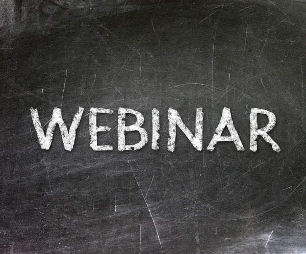 "Webinar" handwritten with white chalk on a blackboard — Stock Photo, Image