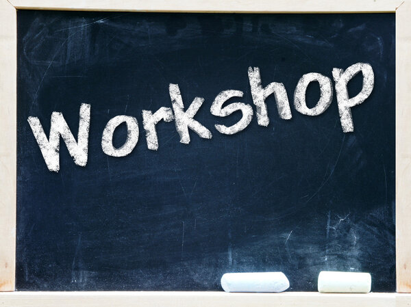Workshop handwritten with white chalk on a blackboard