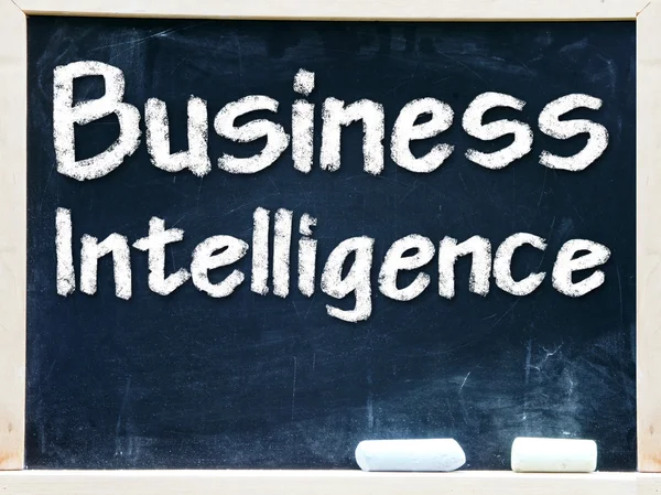 Business Intelligence handwritten with white chalk on a blackboard — Stock Photo, Image