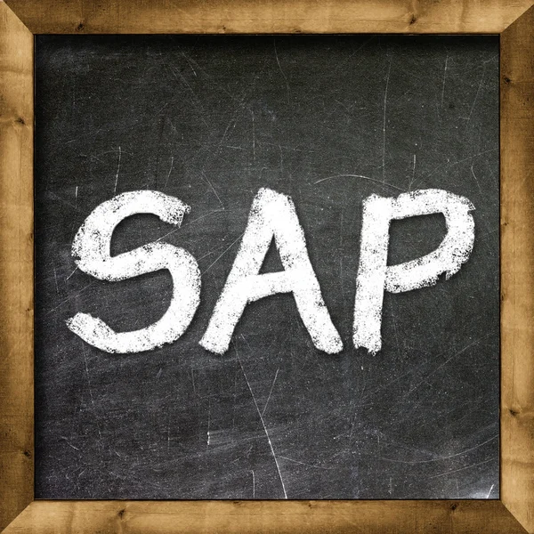 SAP handwritten with white chalk on a blackboard — Stock Photo, Image