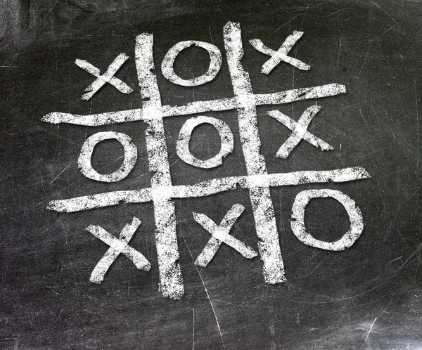 Noughts and crosses drawn by hand on a chalkboard — Stock Photo, Image