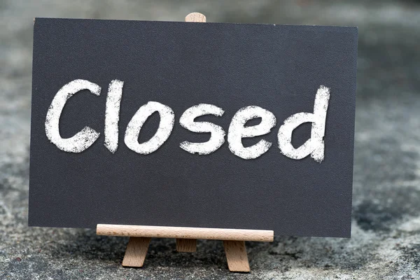 Closed handwritten with white chalk on a blackboard — Stock Photo, Image