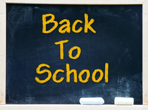 Back to school on blackboard chalkboard — Stockfoto