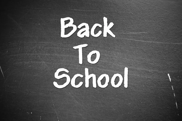 Back to school on blackboard chalkboard — Stok fotoğraf