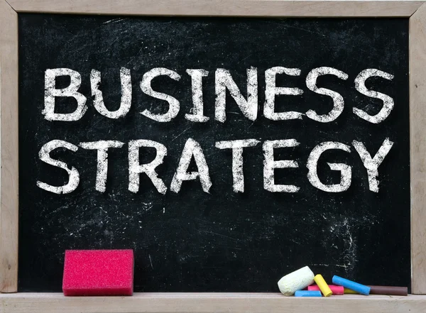 Business Strategy handwritten with white chalk — Stock Photo, Image