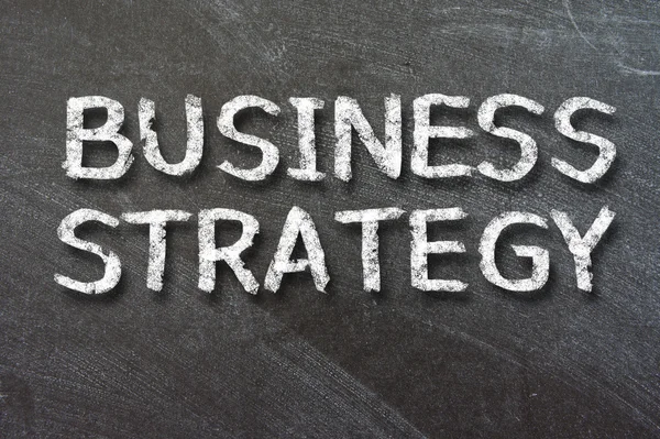 Business Strategy handwritten with white chalk — Stock Photo, Image