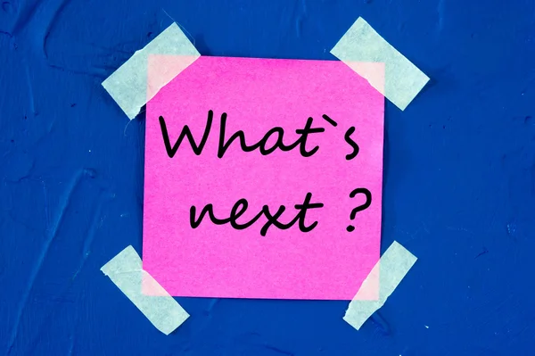 What's Next, written on an pink sticky paper — Stock Photo, Image