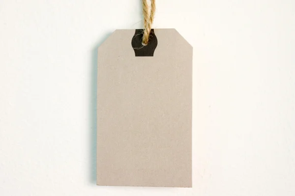 Brown blank tag isolated on background — Stock Photo, Image