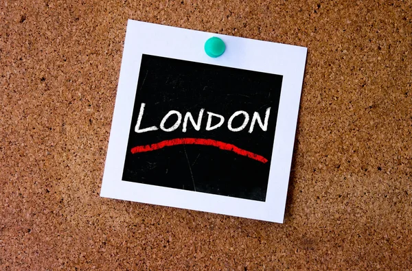 Instant photo pined on cork with London — Stock Photo, Image