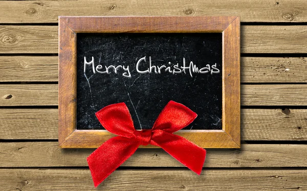 Wooden frame with a red bow — Stock Photo, Image