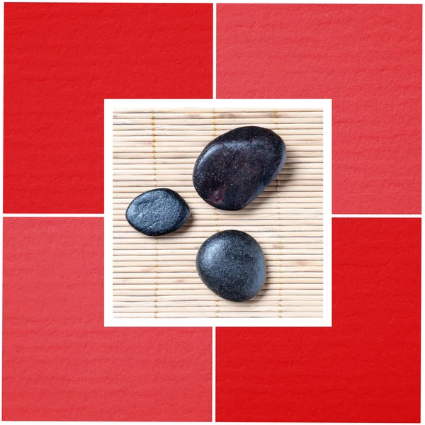 Zwarte stenen tegen bamboe achtergrond — Stockfoto