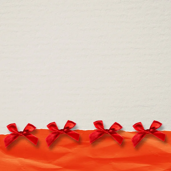 Paper with a red ribbon — Stock Photo, Image