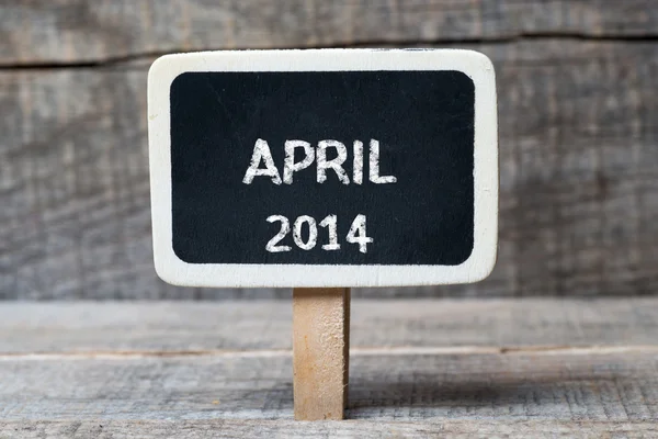 Małe drewniane tablica oprawione kwietnia 2014 — Zdjęcie stockowe