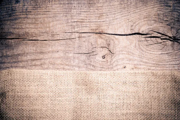 在木桌上的麻布纹理 — 图库照片