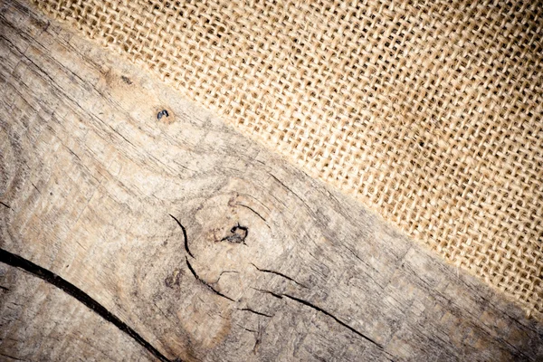 Textura de arpillera sobre mesa de madera —  Fotos de Stock